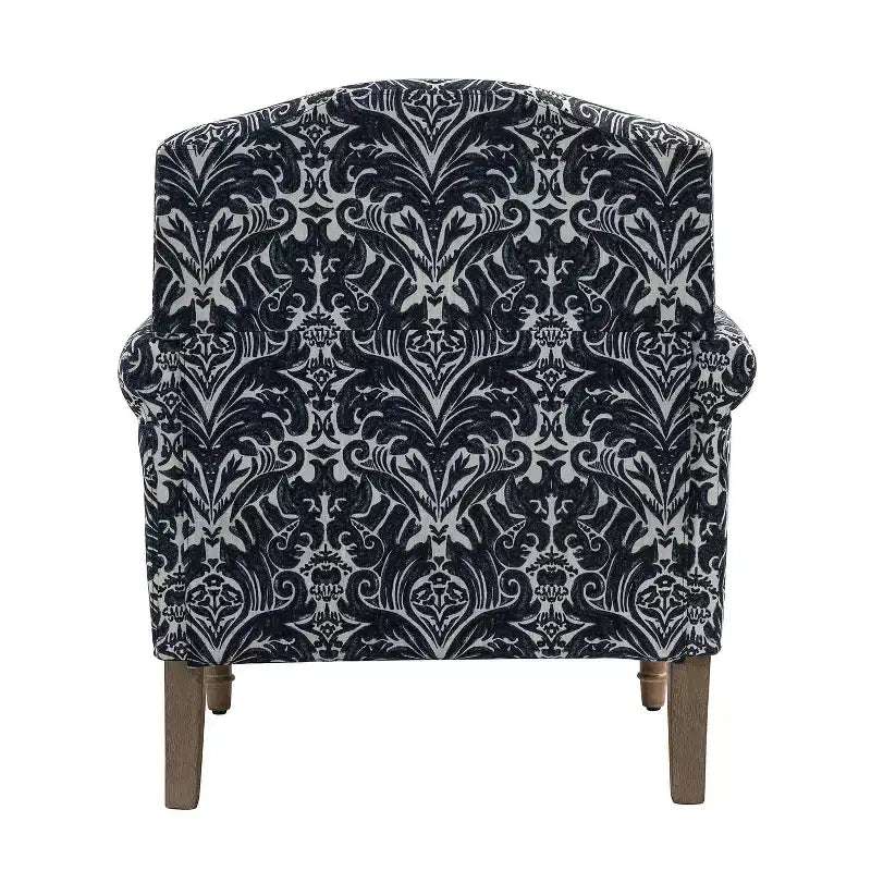 Fauteuil rembourré en bois avec motif floral, accoudoirs à panneaux et dossier en forme de bosse de chameau.